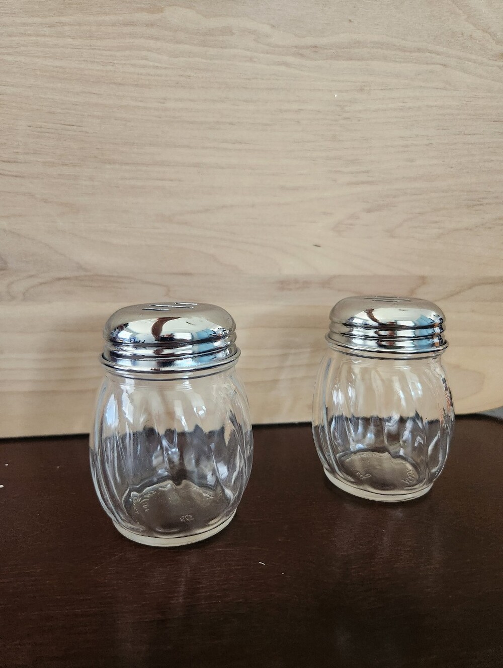 2 TableCraft 6 oz. Swirled glass cheese shakers
